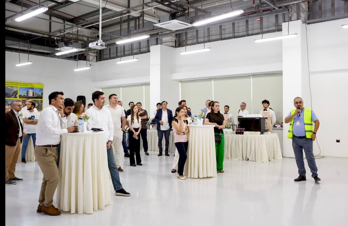 Guests standing in groups at a chamber business mixer