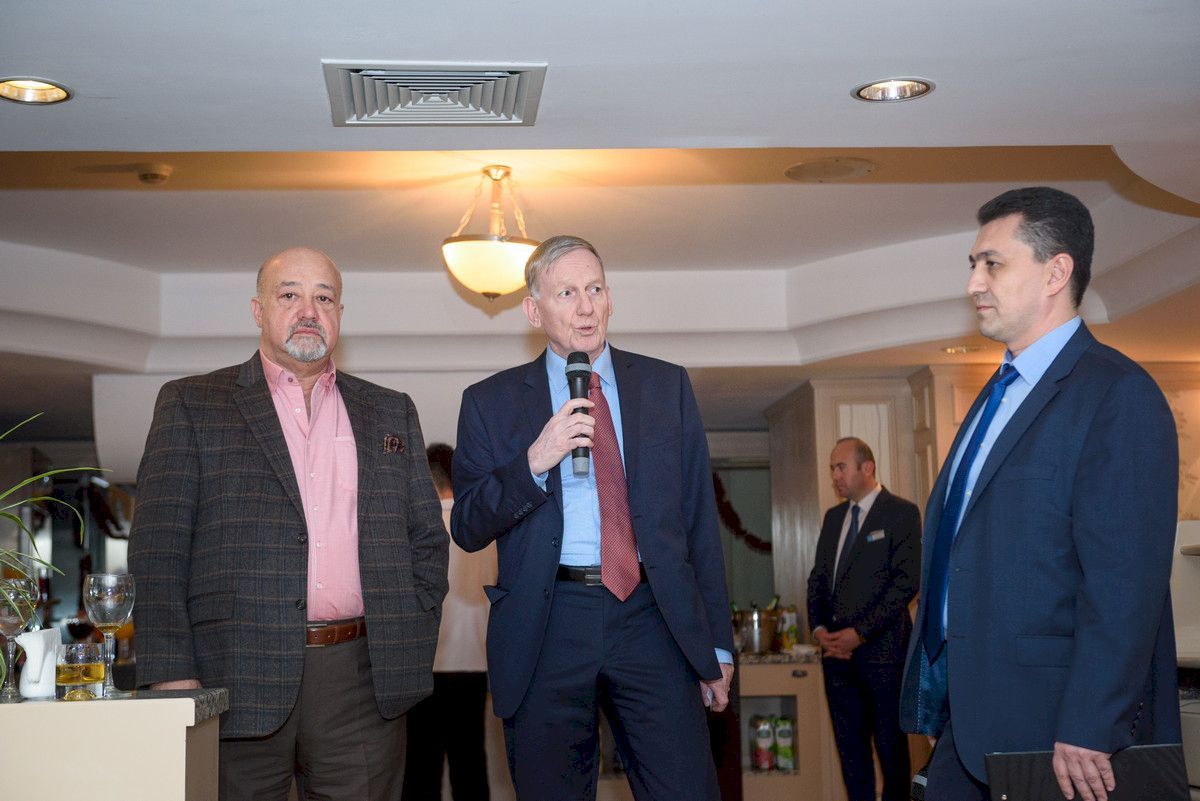 Guests standing in groups at a chamber business mixer