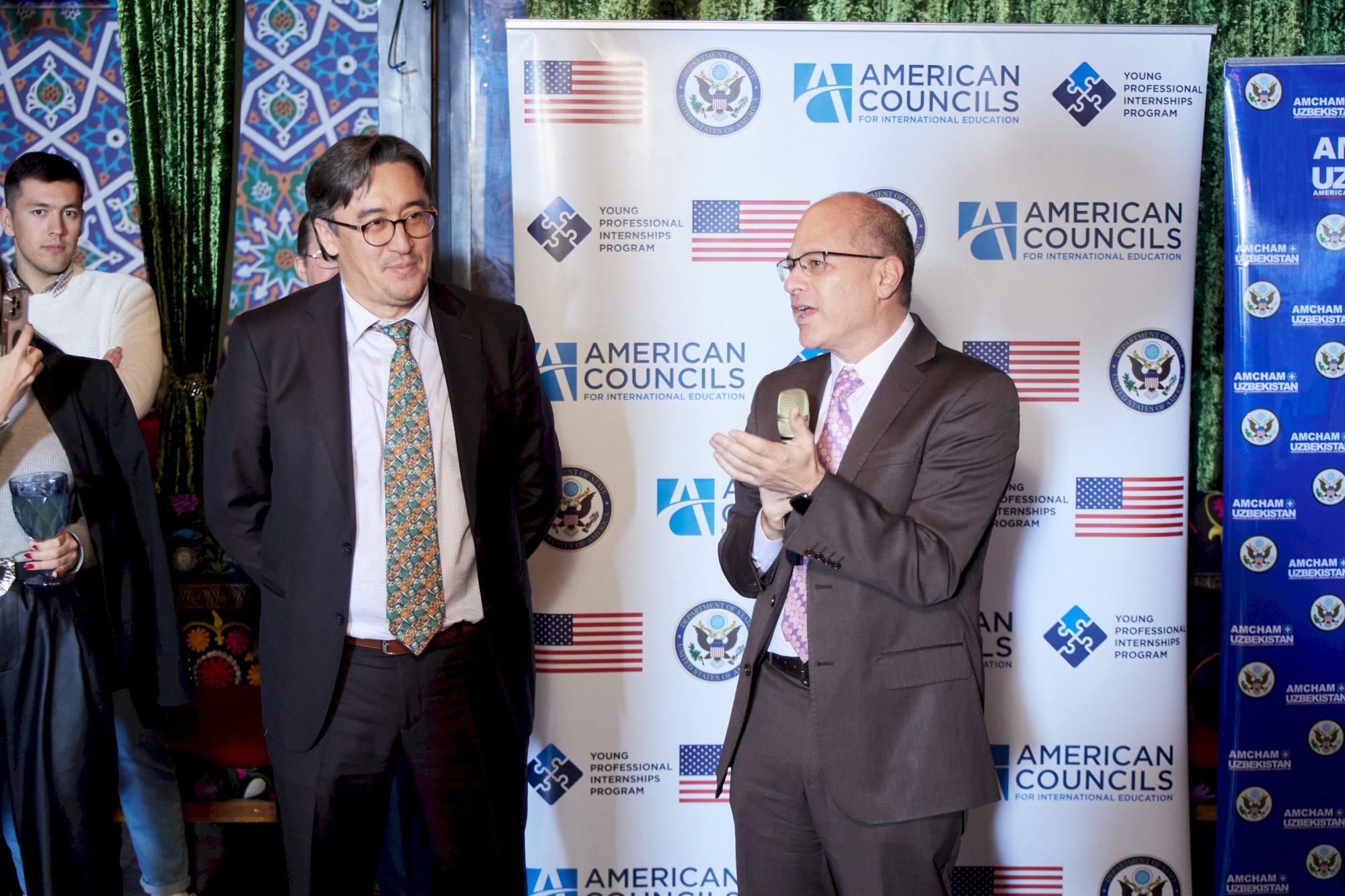 Guests standing in groups at a chamber business mixer