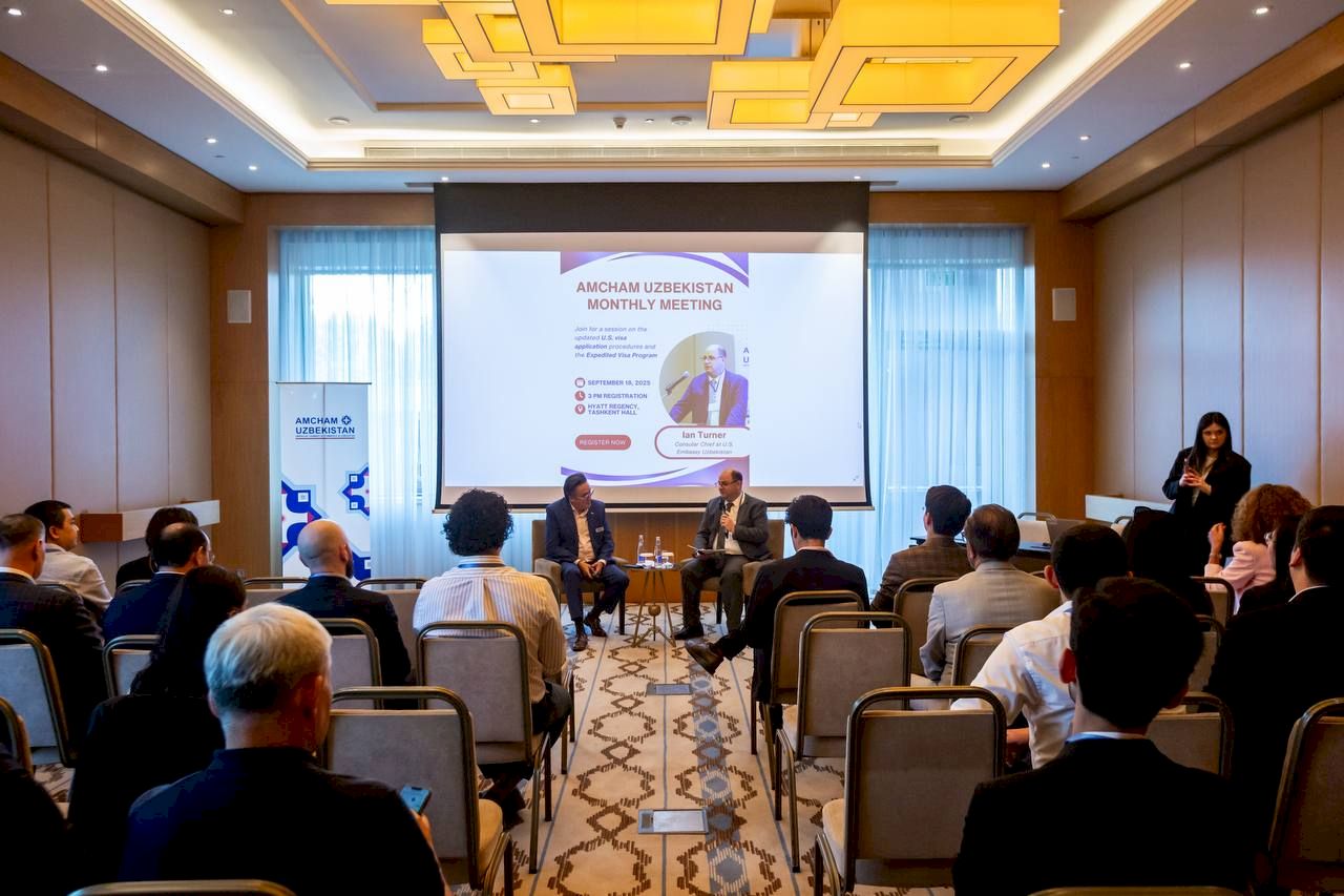A seated audience at a chamber monthly meeting